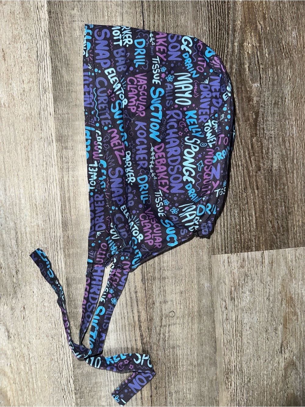 Surgical instruments tie-back surgical cap